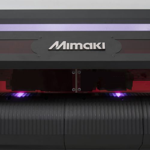 Mimaki logo on a large industrial machine, likely a printer or printer head.
